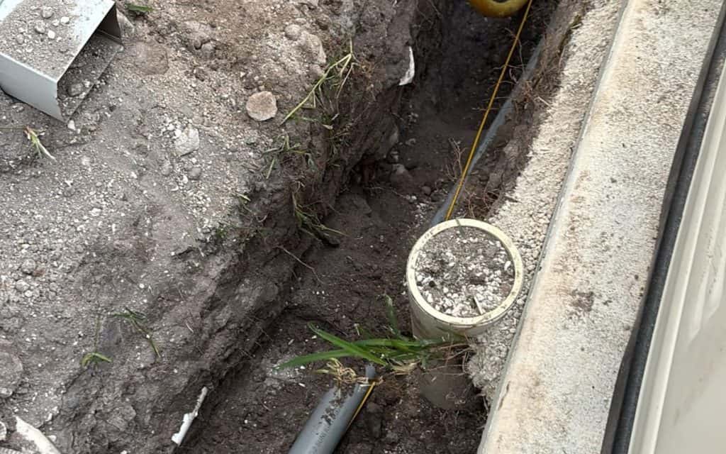 Three-phase conduit and duct bank set in an open bore pit
