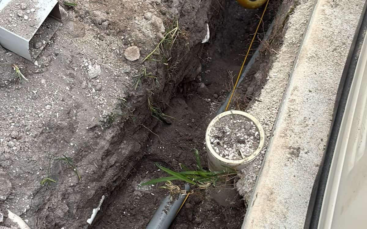 Three-phase conduit and duct bank set in an open bore pit