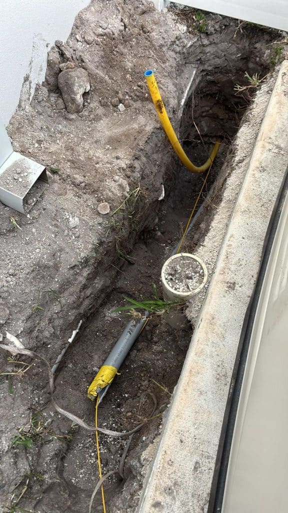 New gas line and conduit in an open bore pit — serving Coconut Creek, FL