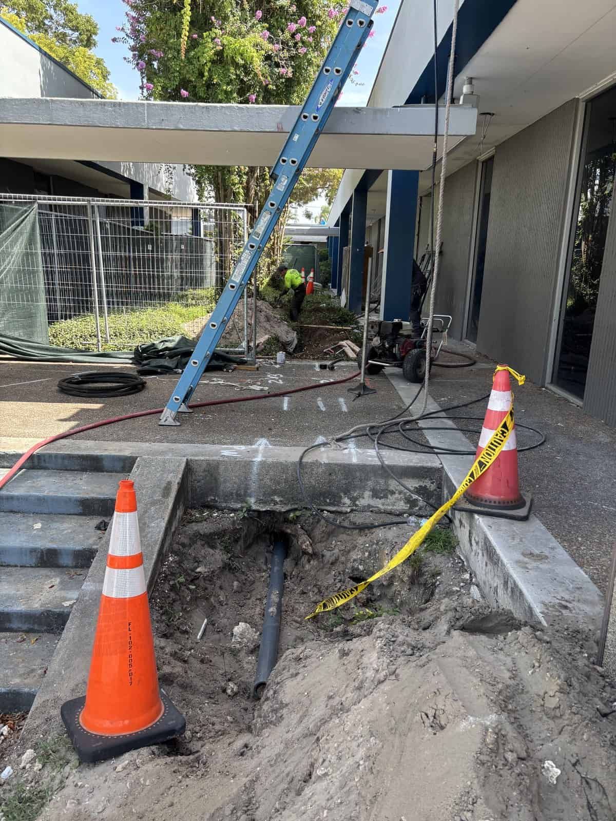 Construction workers repairing underground utilities at Boring Bros.